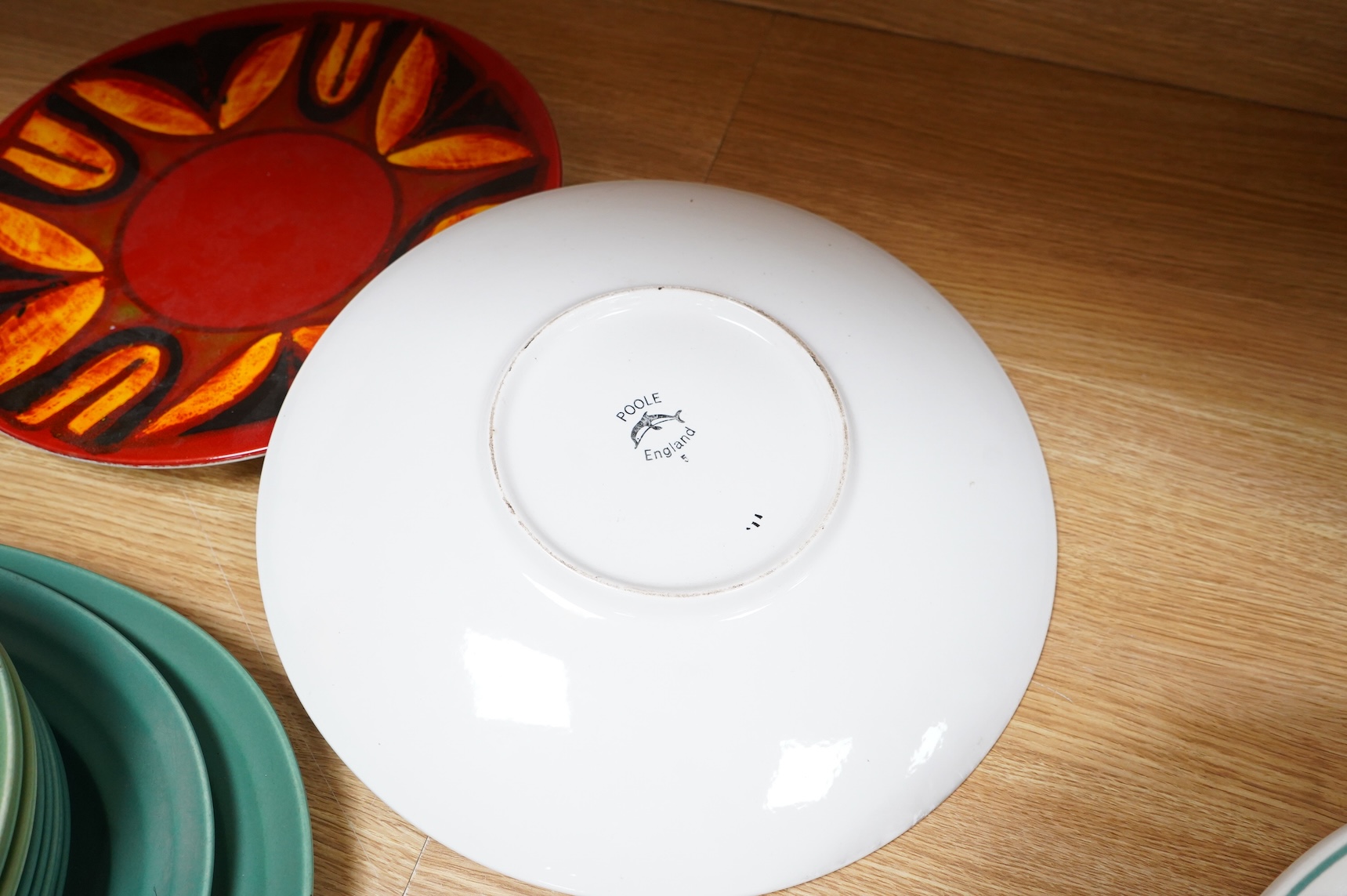 Two mid century Poole pottery Delphis chargers, 36cm in diameter